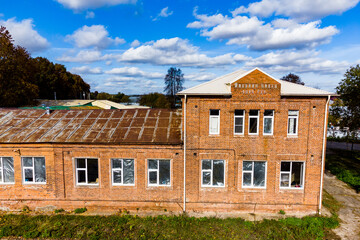 Facade of a former school building from 1914 in the city of Ermolino, Kaluga region, Russia
