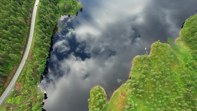 Aerial view of crystal clear reflection of the Fjords and mountains in Norway lake