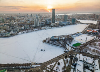 Yekaterinburg aerial panoramic view in Winter at sunset. Yekaterinburg city and pond in winter.