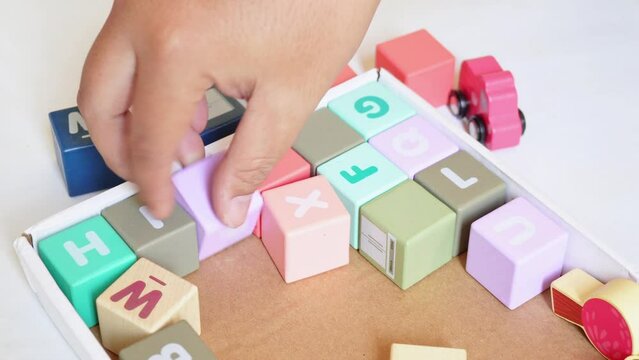 tidy up the messy colorful wooden cube children's toys
