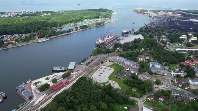 Świnoujście, Poland - Aerial flyover above the ferry harbor of Świnoujście during summer - Ferries coming in to port from Malmo Sweden and Copenhagen