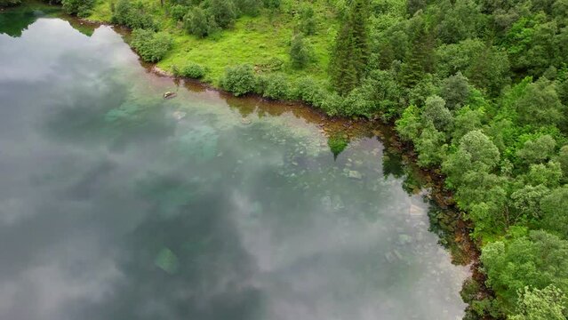 Aerial view of crystal clear reflection of the Fjords and mountains in Norway lake