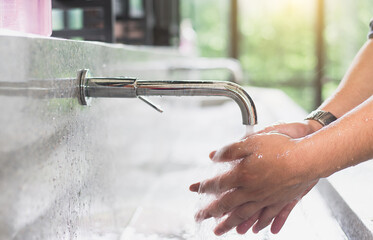 Using soap and water to wash hands can help reduce the transmission of the winter flu virus and...
