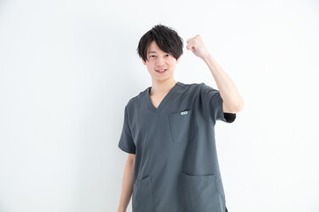 ガッツポーズする整体師　Nurse fist pumping