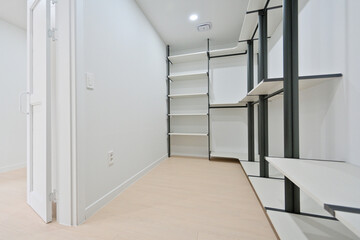 A separate room was created to store clothes using system hangers