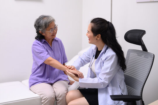 Female doctor counseling female patient about medicine and discussing health care while sitting in office at table. Medical and healthcare concept Doctor prescribing medicine to patient in office