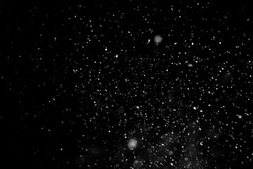 Falling snow isolated on black background - obrazy, fototapety, plakaty