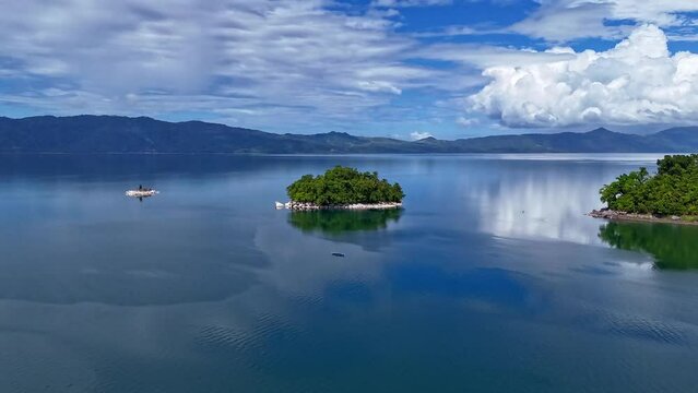 Aerial hyperlapse of Lake Mainit with island. Surigao Del Norte, Philippines