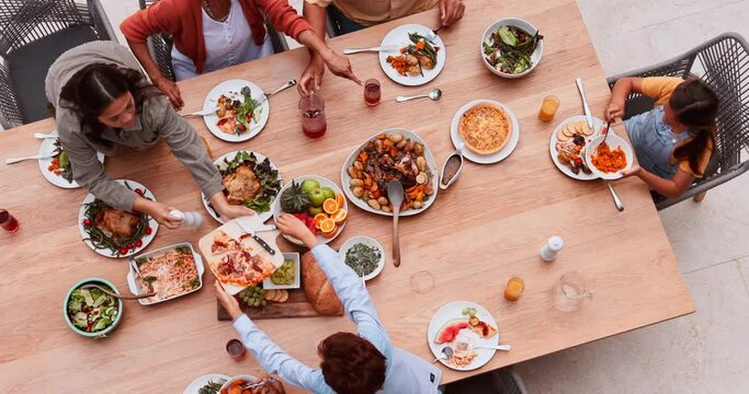 Top view, food and dinner with family or serve for event or party with support, friends and healthy meal. Above, people, lunch or brunch with beverage, celebration or bonding at dining table of home