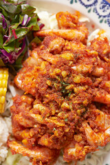 Chili shrimp and salad on a plate