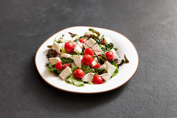 Salad with cheese and cherry tomatoes