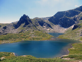 Rila, Bulgaria. August 01 ,2023. Summer. Sunny day. Picturesque view of the mountain Rila and The Twin lake (Bliznaka).