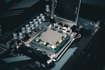 Fototapeta premium Computer processor from 2023 - CPU sitting in a motherboard on a gaming computer