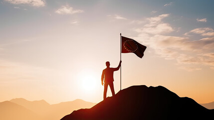 Silhouette of businessman holding flag on the top of mountain with over blue sky and sunlight. It is symbol of leadership successful achievement with goal and objective target. - obrazy, fototapety, plakaty