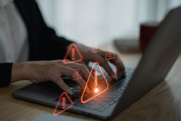 Businesswoman using laptop showing virtual screen icon caution warning triangle and exclamation sign icon Warning of dangerous problems Server error. Virus. Internet network security concept. - obrazy, fototapety, plakaty