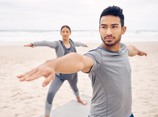 People, yoga and warrior pose on beach for fitness, exercise and holistic wellness, teamwork or workout outdoor. Couple of friends or instructor stretching with balance, health and pilates by ocean