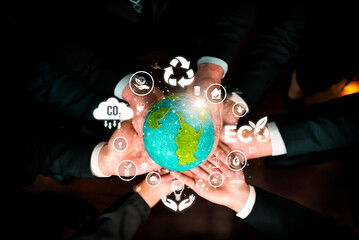 Business partnership holding Earth globe together with eco design icon symbolize ESG sustainable...