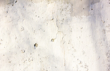 White plaster, damaged wall, dilapidated texture of white concrete wall. Rough pattern plaster....