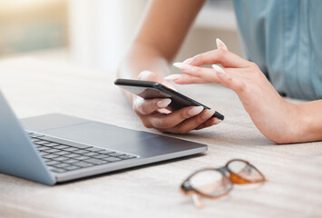 Hands, phone and a business woman at a desk in her office for communication, networking or search. Laptop, planning and glasses with an employee typing a text message closeup in the workplace