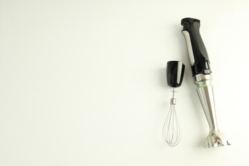Black blender with attachments on white background, space for text