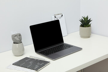 Fototapeta premium An open laptop on a white table