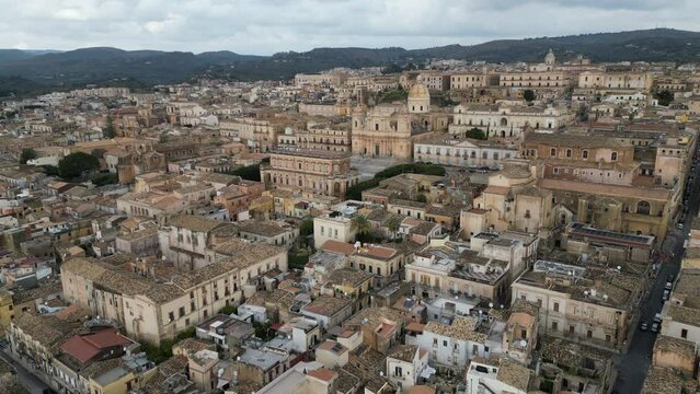 Flying towards famous Basilica Cattedrale di San Nicolo, baroque architecture and historic landmark in Noto Sicily Italy
