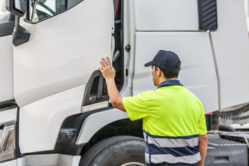 Unrecognizable male driver opening door of truck