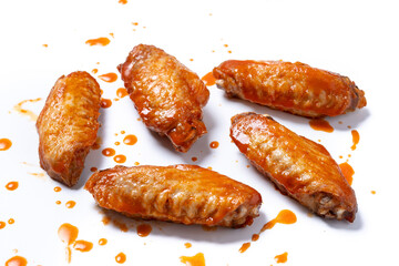 Buffalo spicy chicken wings with cayenne pepper sauce isolated on white background
