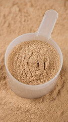 Chocolate color protein, whey powder in cup. Bodybuilding, fitness and gym lifestyle
