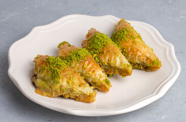 Turkish Dessert Sobiyet Baklava. Turkish pistachio baklava on a white background. Local name şöbiyet baklava