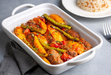 Traditional Homemade Turkish Food Kofte - Kofta with Tomato Sauce and Potatoes. (Turkish name; Izmir kofte)