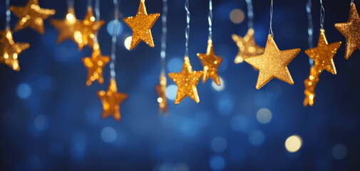 New Year's background with garlands in the form of stars, New Year's mood. Gold and yellow stars on a blue, blue and purple blurred background. Christmas - obrazy, fototapety, plakaty