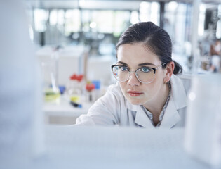 Woman, medical research and lab thinking for vial discovery or future vaccine, review or health technology. Female person, glasses in study breakthrough or antibiotic, help results or innovation idea - obrazy, fototapety, plakaty