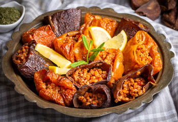Dried eggplant stuffed and dried pepper stuffed with rice, tomato and olive oil known as dolma. (Turkish name; kuru biber dolmasi, kuru patlican dolmasi)