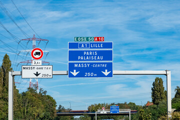 Highway road signs Paris, driving in heavy traffic on ring road of capital of France, traffic problems in Paris