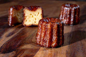 Canele, French pastry flavored with rum and vanilla, soft and tender custard center and  dark,...