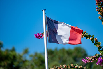 French flag on beach houses in Arcachon Bay Cap Ferret peninsula, France, southwest of Bordeaux...