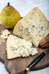 Cheese collection, English semi-soft, crumbly old stilton blue cheese close up
