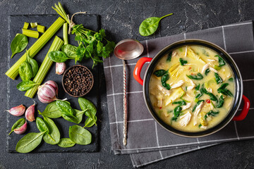 chicken spinach artichoke creamy soup in a pot