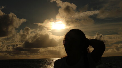Sunlight shines through the clouds onto the sea surface at sunset in the Indian Ocean, photo taken...
