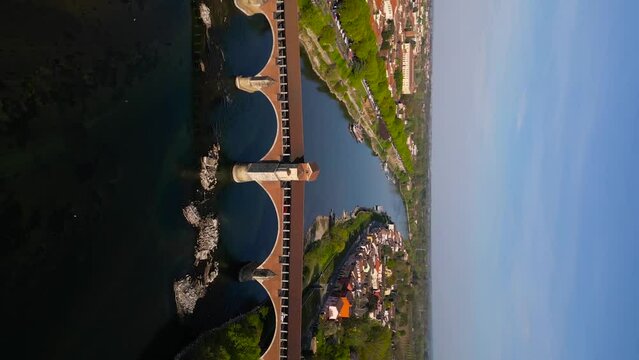 Europe, Italy, Pavia - Drone aerial view of Pavia City in Lombardy with Ponte Coperto covered bridge on the Ticino and Po river