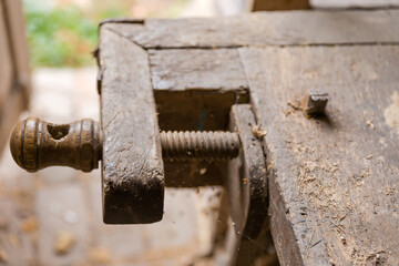 Fragment of the old vintage woodworking workbench, selective focus