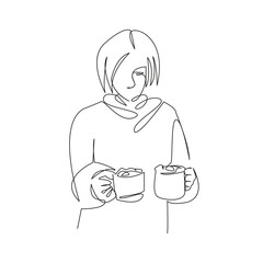 Christmas morning girl holding two hot chocolates in her hands