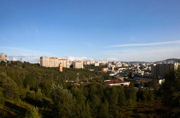 A picturesque view of the city from the observation deck on the southern shore of Semenovskoye Lake. Murmansk. Russia