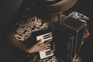 woman playing the accordion, vintage style