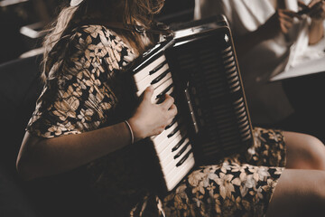 woman playing the accordion, vintage style