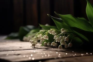 Zelfklevend Fotobehang lilies of the valley on a wooden table in a dark room © Dennis
