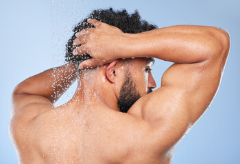 Man, shower back and splash in studio with water, wash or hygiene with self care by blue...