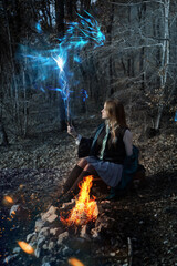 young sorceress in the forest. patronus spell. Slytherin