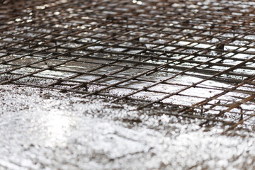 Closeup concrete in reinforced structures, foundation of floor with Iron frame, cement building site